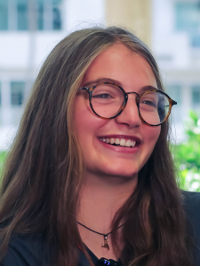 smiling young lady with glasses